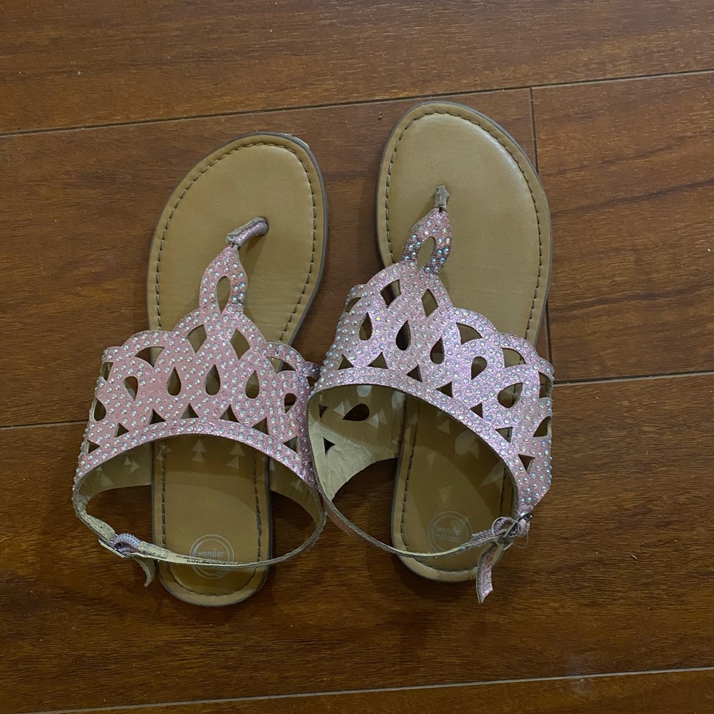 Pink sandals and Justice messenger bag